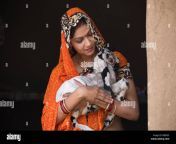 happy indian woman stroking baby goat at village house rb5055.jpg from desi ladki ki chudai janwar se hindi xxx video downlods desi sexhindi xnx