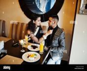 lovely indian couple in love wear at saree and elegant suit posed on restaurant woman tied tie on her man rytrfj.jpg from desi lover romance in restaurant
