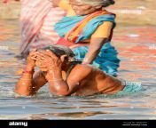 indian hindu women wearing saris perform early morning bathing rituals in the river ganges in varanasi uttar pradesh india south asia w8myph.jpg from indian wife bathing with pavadai