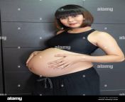 portrait of pregnant asian woman touching her big belly happily wa2wap.jpg from 3gp japanese pregnant porn sex com