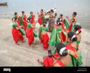 young indian girls dance and enjoy holiday trip at the varanasi ganges river ghat with view of wooden boats wg3yjt.jpg from desi river boat dance with friends