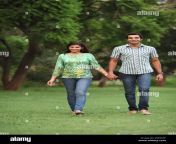 indian young couple walking in a park w0g04f.jpg from andhra couple in public park sexmp4