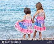 two sisters standing on beach holding hands x80he2.jpg from beautiful sisters helping hands at home