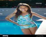 beautiful little latin girl in a bathing suit by the pool ahrfkj.jpg from www south young lady bathing video downloads