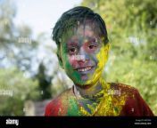 a smiling young boy shows off his colored face and poses during festival am72nx.jpg from young indian shows off on webcam
