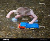 little naked boy playing in water a16xrk.jpg from little naked