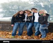 group of four caucasian teenagers one boy and three girls smile into a077kt.jpg from 1 ladka ka 3 ladki