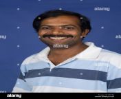 portrait of a smiling middle aged indian man b515jj.jpg from agedindian