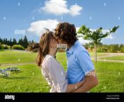 teen lovers kissing in park b4wnbx.jpg from lovers smooching in park