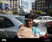 a beggar girl holding a baby in traffic dhaka b6dp56.jpg from bangla small school gril sexan 12 little sex