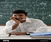 teacher sitting at his desk be9fnn.jpg from indian school teacher x
