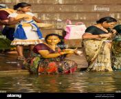 women come to bathe and pray in the holy waters of the ganges river bfkwc0.jpg from ganga nadi snan in ladies opan changing sexw
