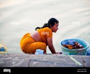 indian woman washing dress at river bhcmhm.jpg from tamil aunty long hair washing shampoo by
