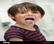 young boy sticking out his tongue portrait bn3whk.jpg from young stick tongue out
