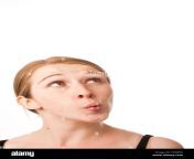 a young caucasian woman looking upwards confused sucking in her cheeks c5np06.jpg from looking sucking