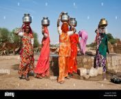 indian women wearing saris carrying water jugs on their heads they crea34.jpg from desi jugs video