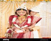 couple performing anjali ceremony in bengali wedding c1a1jc.jpg from priya anjali rai full bangla naked mega