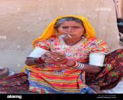 a woman from kutch district of gujarat smoking beedi a local cigarette c2eewe.jpg from gujarati smoking female