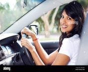 young indian woman driving a car d9h2mn.jpg from indian in car