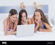 grils on bed looking at laptop dec4n8.jpg from www and grils a