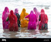 hindu pilgrims women in colourful saris taking a holy bath om the ddhwrx.jpg from holy bath