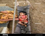 indian baby girl sleeping in a homemade cradle in a rural indian village dj2dkj.jpg from indian village sleeping