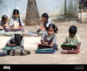 rural indian village school children in an outside class writing on dmkmjx.jpg from xxx indian village small school hindi sex bus