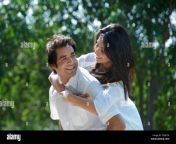 man carried his girlfriend piggyback in a park japanese park rohini d3xhtk.jpg from indian b f g f kiss