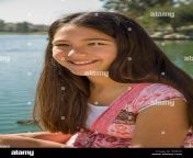hispanic caucasian teen girl 11 13 year old smiling portrait in park egpjte.jpg from chicas 13