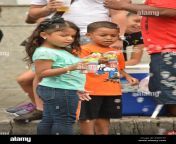 puerto rican kids playing with a bubble machine toy in the street egw77p.jpg from kids pr