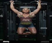female bodybuilder doing heavy weight exercise for back in gym ewy9g2.jpg from fbb gym