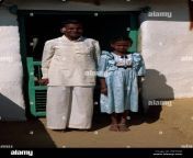 father and daughter wearing sunday best clothes in an indian village ew70g0.jpg from desi village wearing cloths