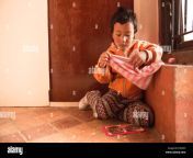 kathmandu nepal nepali child age 4 plays and poses for camera in nayapati e203xh.jpg from nepali small age
