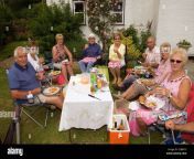 group of people enjoying a picnic and drinks at a summer gardenpimms e2bmtc.jpg from picnic garden mms