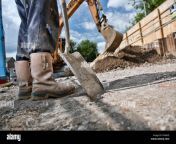 workers legs and shovel on a construction site f9a8h5.jpg from leg workers