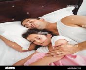 daughter sleeping beside father on bed at home fk0kea.jpg from daddy sex sleeping