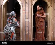 two women neighbors neighbours are talking at the entrance india fj1meg.jpg from indian neighb