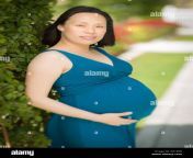portrait of happy young pregnant chinese woman in the park g61e8r.jpg from pregnant china rap jo sex xxx
