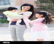 happy young chinese mother with her two daughters gen5cn.jpg from china mother and son xxx