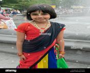 a 10 year old girl from bangladesh in a traditional colorful dress g3x7c8.jpg from 10 saal ki dhaka aur ladka