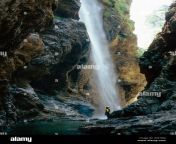 woman under a waterfall in a canyon talgau salzburg austria h9e1w0.jpg from talgau