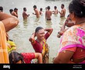 women and men praying and bathing in the ghats of ganges river varanasi hndn2y.jpg from moti aunty bath rive