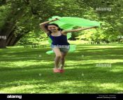 young skinny girl running happy in park hxn5jy.jpg from young skiny