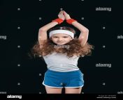 girl posing in sportswear isolated on black 12 year old kids children jetm0w.jpg from 12 old posing