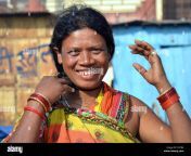 smiling and laughing indian adivasi woman does her hair with both jy2yb4.jpg from adibasi xxx adivasi group jpg 480 480 64000 jp