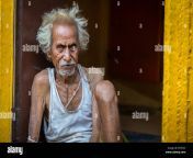 close up of an old man sitting at his doorway in an alley at varanasi kh4723.jpg from desi village real old maa beta ki çhudai