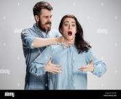 the quarrel men and women man strangling a woman on gray background kpy3r2.jpg from strangled stranglenail production clip