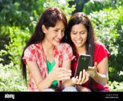 3 indian young friends sharing message phone garden happy fun kx5tw8.jpg from indian friend and bayxe
