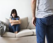 unhappy couple arguing on the sofa pk8pn9y.jpg from how to tell your spouse that he she is getting on jpg