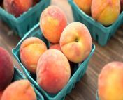 peaches in baskets on a wooden table.jpg from peach